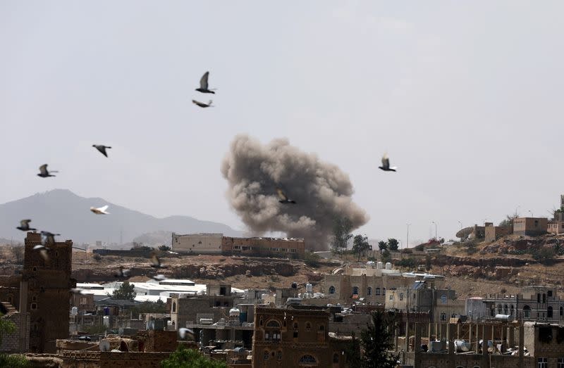 Dust rises from the site of a Saudi-led air strike in Sanaa