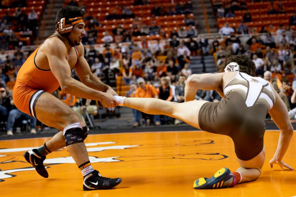 Oklahoma State's AJ Ferrari drags Lehigh's JT Davis back into the circle during Sunday's match at Gallagher-Iba Arena in Stillwater. The fourth-ranked Cowboys won 26-9 over No. 15 Lehigh