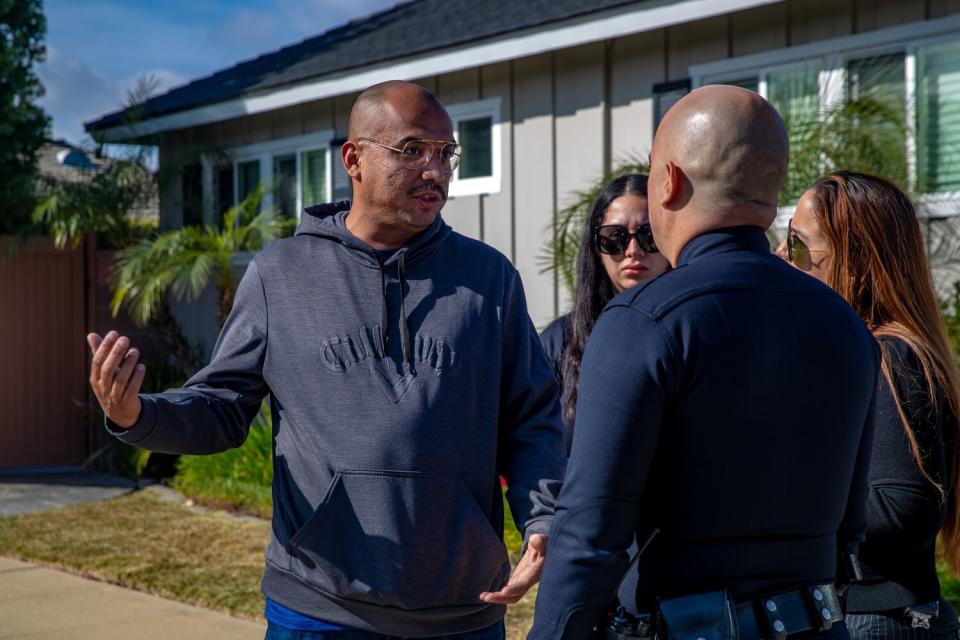 Daniel Chavarin, left, father 17-year-old Xavier Chavarin who was fatally stabbed last week in El Sereno, talks police