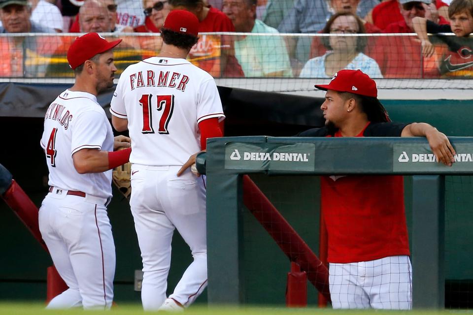 Cincinnati Reds starting pitcher Luis Castillo (58) pats Cincinnati Reds shortstop Kyle Farmer (17) on the back after a double play ends the top of first inning of the MLB Interleague game between the Cincinnati Reds and the Baltimore Orioles at Great American Ball Park in downtown Cincinnati on Friday, July 29, 2022. The Reds led 2-0 after five innings on a two-run homer by Joey Votto in the first inning. 