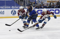 Colorado Avalanche's Samuel Girard (49), left and Mikko Rantanen (96) defend against St. Louis Blues' Vladimir Tarasenko (91) during the second period of an NHL hockey game on Wednesday, April 14, 2021, in St. Louis. (AP Photo/Joe Puetz)