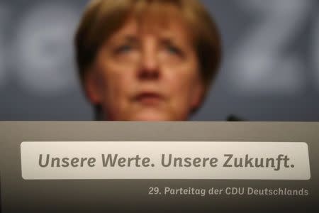 German Chancellor and leader of the conservative Christian Democratic Union party CDU Angela Merkel addresses the CDU party convention in Essen, Germany, December 6, 2016. REUTERS/Kai Pfaffenbach