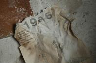 <p>A calendar from the fateful year 1986 lies on the floor of a former hospital (Getty Images) </p>
