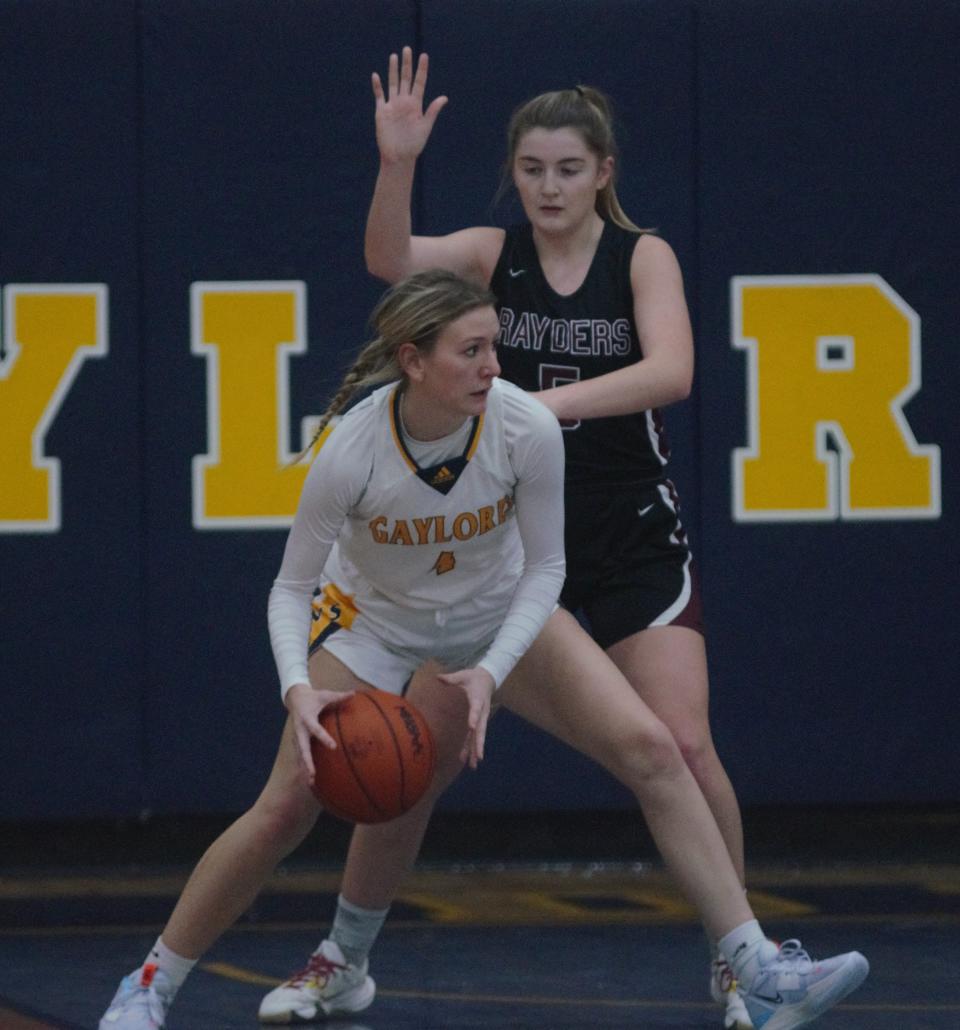 Meghan Keen looks to pass out of the post during a basketball matchup between Gaylord and Charlevoix on Tuesday, December 6 in Gaylord, Mich.