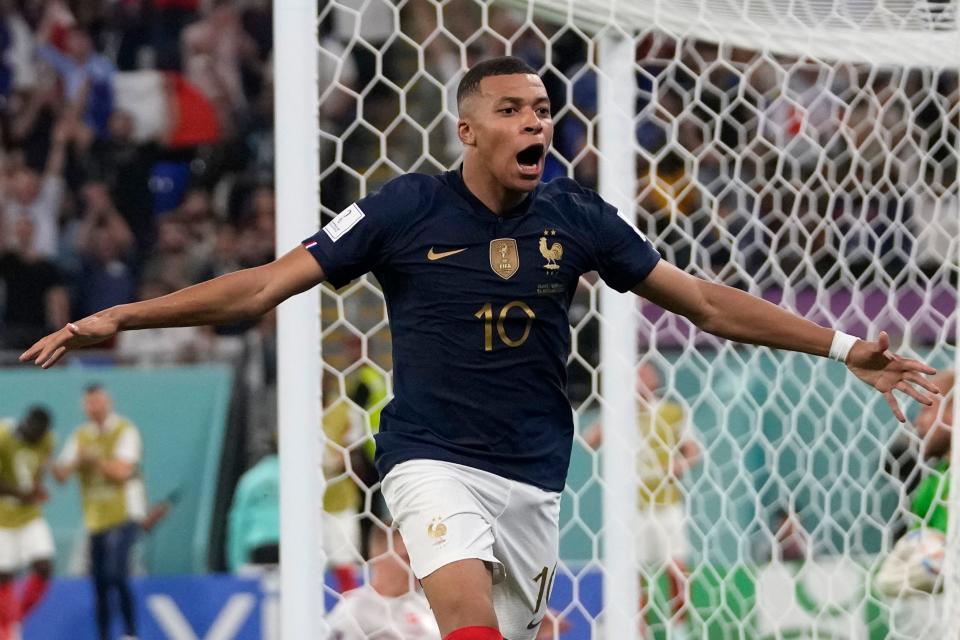 France's Kylian Mbappe celebrates after scoring his second goal during the World Cup group D match between France and Denmark, at the Stadium 974 in Doha, Qatar, Saturday, Nov. 26, 2022. With the win, France secured advancement from the group stage to the knockout rounds.