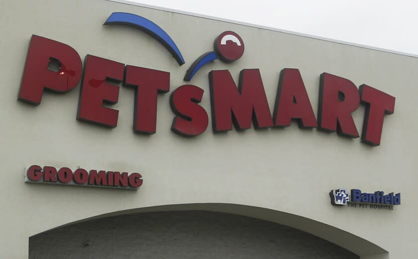 FILE - This May 24, 2005, file photo shows a sign of a pet store chain, PetSmart, in Warwick, R.I. PetSmart's online pet store Chewy, went public Friday, June 14, 2019. (AP Photo/Stew Milne, File)