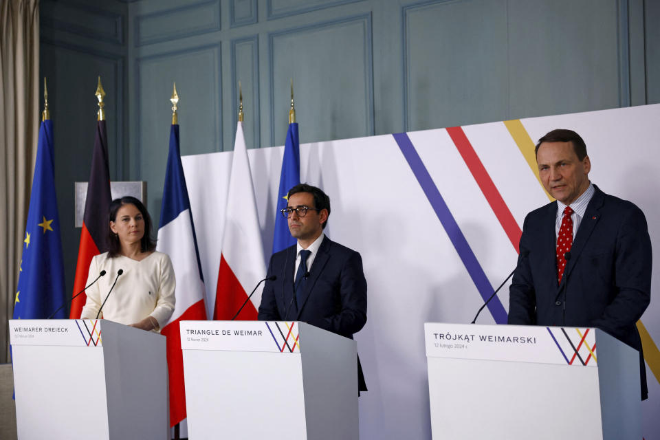 French Foreign and European Affairs Minister Stephane Sejourne, center, German Foreign Minister Annalena Baerbock, left, and Polish Foreign Minister Radoslaw Sikorski attend a press conference after the Weimar Triangle talks at the Chateau de La Celle Saint-Cloud near Paris, Monday, Feb. 12, 2024. The foreign ministers of France, Germany and Poland met on Monday as they seek to revive the so-called Weimar Triangle, a political format that has been dormant for years. The Weimar Triangle was created in 1991 as Poland was emerging from decades of communist as a platform for political cooperation among the three nations. (Sarah Meyssonnier, Pool via AP)