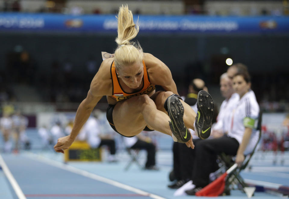 Netherlands' Nadine Broersen makes an attempt in the long jump of the women's pentathlon during the Athletics Indoor World Championships in Sopot, Poland, Friday, March 7, 2014. (AP Photo/Matt Dunham)