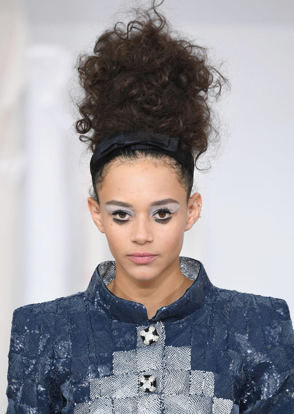 Chanel: Towering curly topknot & doll eye makeup