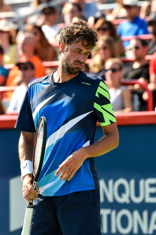 Robin Haase of Netherlands reacts after losing a point against Roger Federer of Switzerland during their ATP Rogers Cup semi-final match, at Uniprix Stadium in Montreal, Quebec, on August 12, 2017