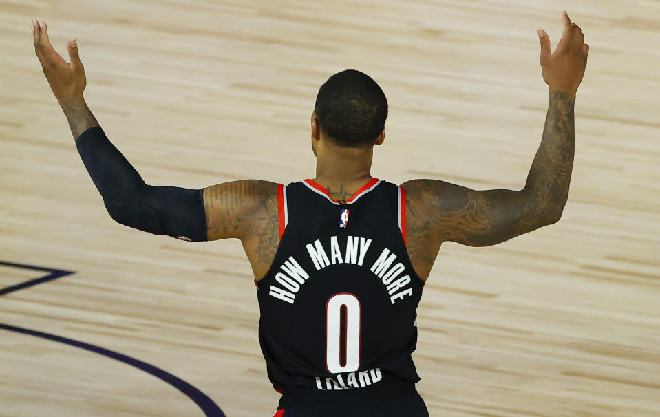 Portland Trail Blazers' Damian Lillard calls for a foul against the Memphis Grizzlies during the second half of an NBA basketball game Saturday, Aug. 15, 2020, in Lake Buena Vista, Fla. (Kevin C. Cox/Pool Photo via AP)