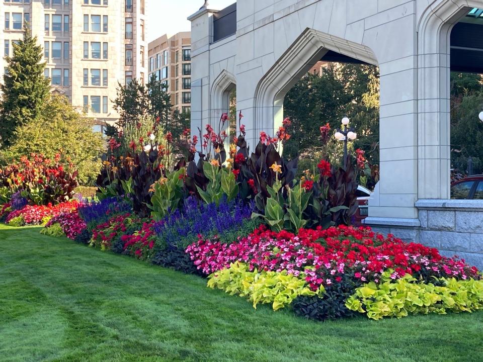 Vivid flower gardens surround the Empress Hotel.