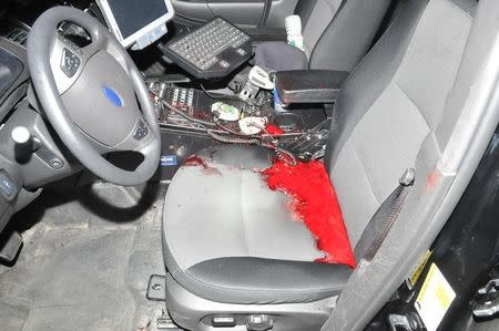 Blood is seen in a police car on a street where Tamerlan and Dzhokhar Tsarnaev engaged in a gunfight with police in this undated handout evidence photo provided by the U.S. Attorney's Office in Boston, Massachusetts on March 24, 2015. REUTERS/U.S. Attorney's Office/Handout