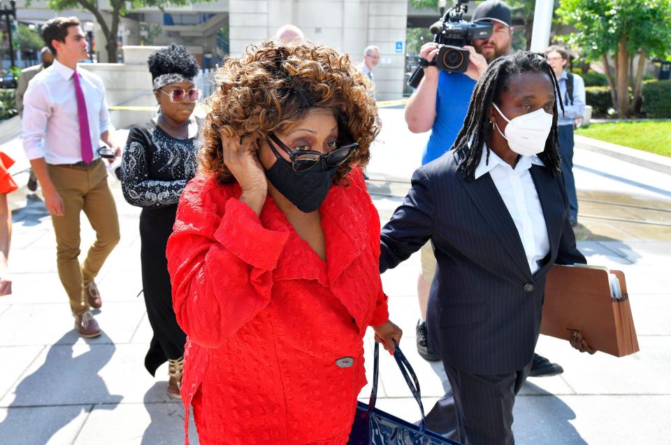 Former U.S. Rep. Congresswoman Corrine Brown enters Jacksonville's federal courthouse with defense attorney Sandra Young before a plea hearing Wednesday.