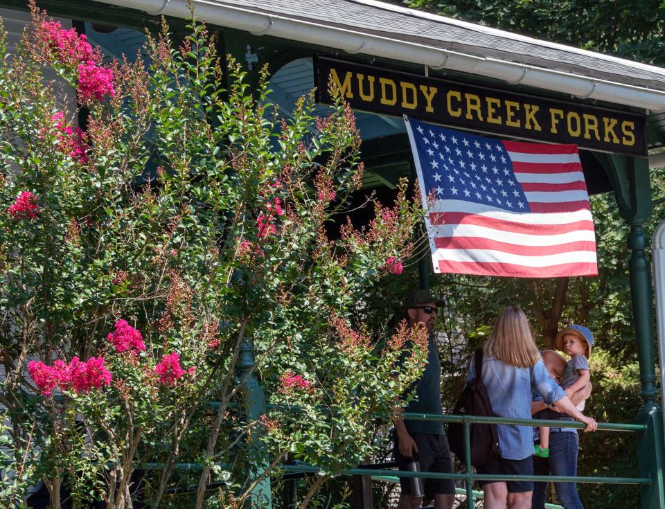 People wait to board the train during the Old Fashioned Family Picnic in 2019 sponsored by the Ma & Pa Railroad Heritage Village at Muddy Creek Forks.