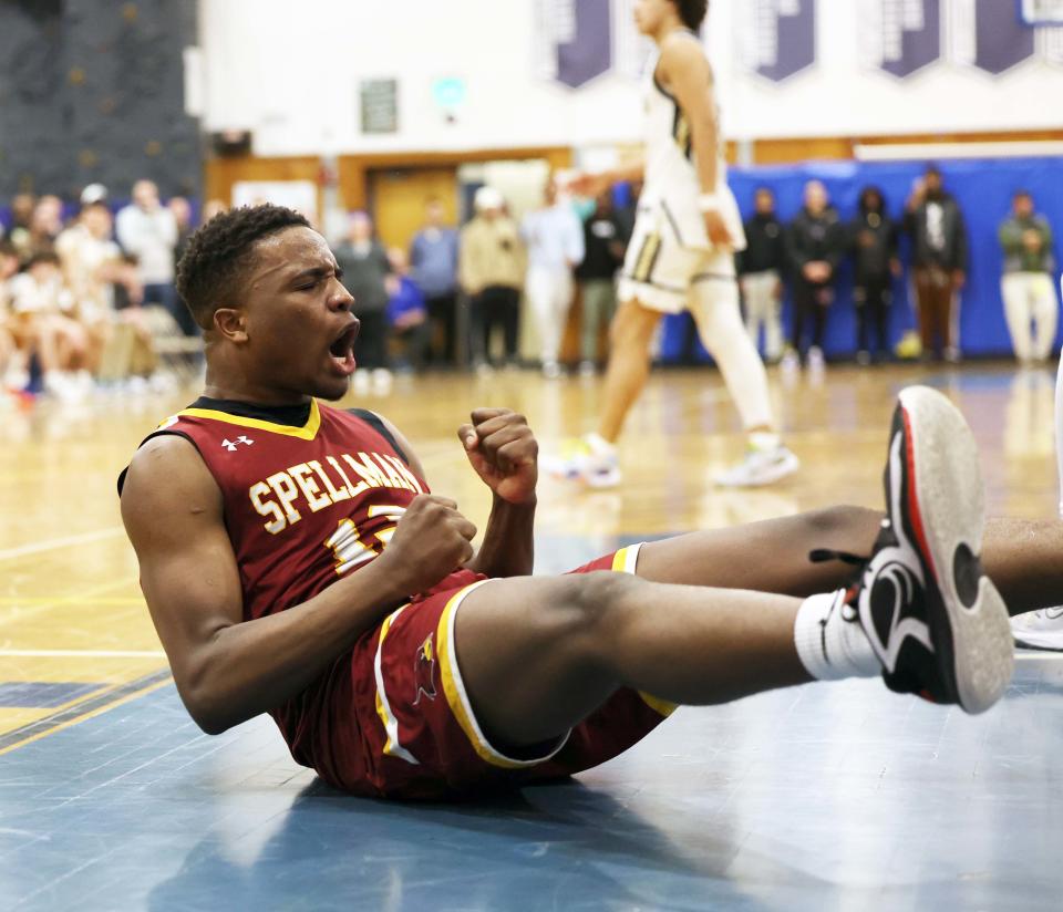 Cardinal Spellman's Jaydan Exalus celebrates his basket and a foul during a game versus Archbishop Williams at Scituate High School on Wednesday, March 15, 2023.  