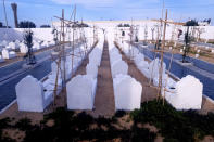 The cemetery for migrants who have died trying to reach Europe, in the village of Zarzis, Tunisia, Saturday June 12, 2021. A newly sanctified cemetery for Tunisia's migrant dead is filling quickly. Rachid Koraïchi bought the plot of land in the port city of Zarzis a few years ago and started designing what he hoped would be the final resting place for people who died on the move. (AP Photo/Mehdi El Arem)