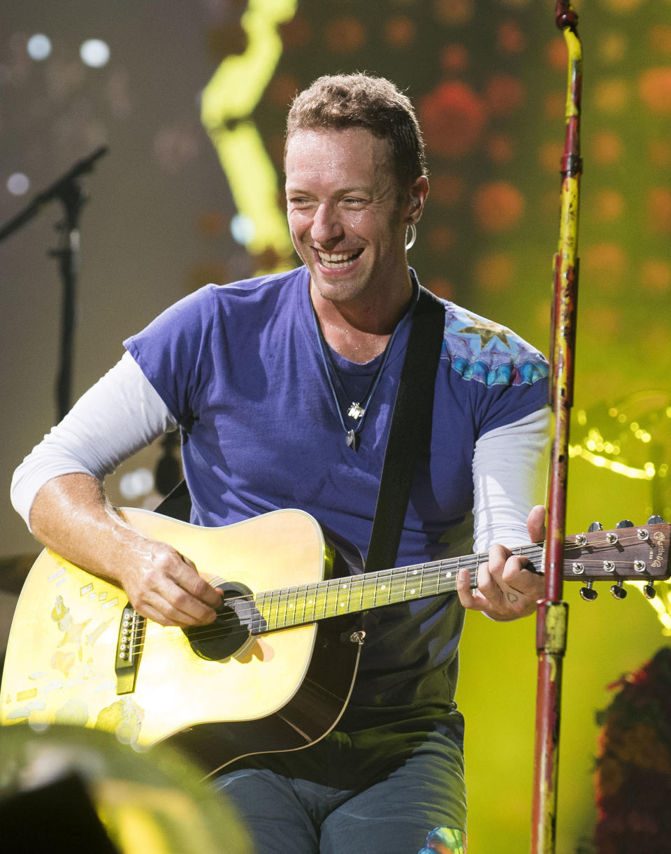 FILE - Chris Martin of Coldplay performs in Toronto on Aug. 21, 2017. Coldplay's "Everyday Life" is nominated for a Grammy Award for best album. The 63rd Annual Grammy Awards will be held on March 14. (Photo by Arthur Mola/Invision/AP, File)