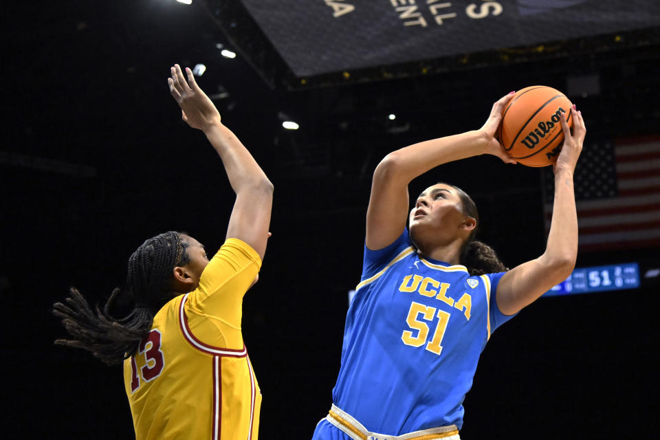 UCLA center Lauren Betts (51) shoots against Southern California center Rayah Marshall during the first half of an NCAA college basketball game in the semifinals of the Pac-12 women's tournament Friday, March 8, 2024, in Las Vegas. (AP Photo/David Becker)