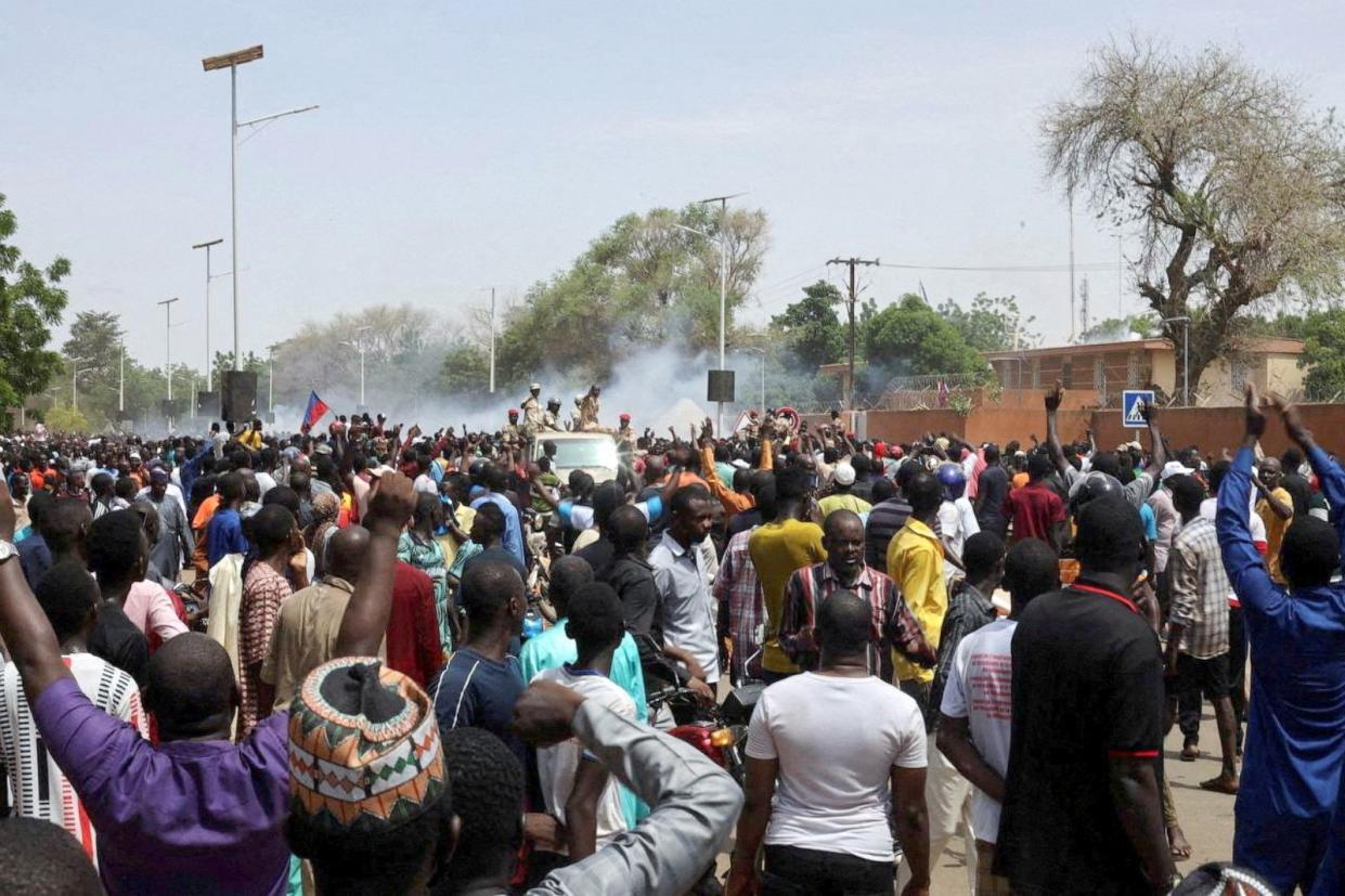 PHOTO: Nigerien security forces launch tear gas to disperse pro-junta demonstrators gathered outside the French embassy, in Niamey, the capital city of Niger July 30, 2023. (Reuters)