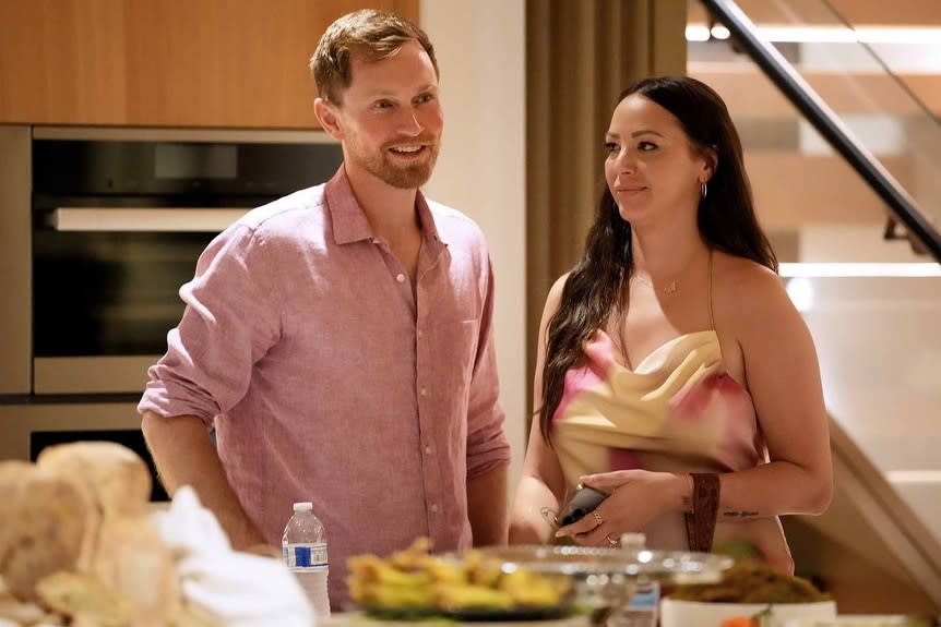 Luke Broderick and Kristen Doute chat at dinner.