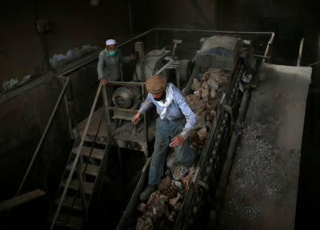Men work at the Jabal Saraj cement factory in Jabal Saraj, north of Kabul, Afghanistan April 19, 2016. . REUTERS/Ahmad Masood