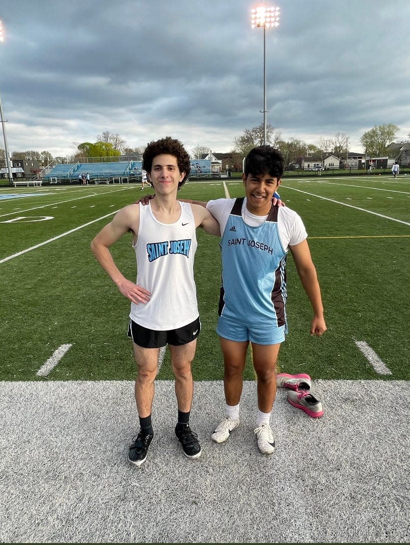 Saleem Qasem (left) poses with one of his teammates following one of South Bend Saint Joseph's boys track meets [PHOTO PROVIDED BY SAINT JOSEPH ATHLETICS]