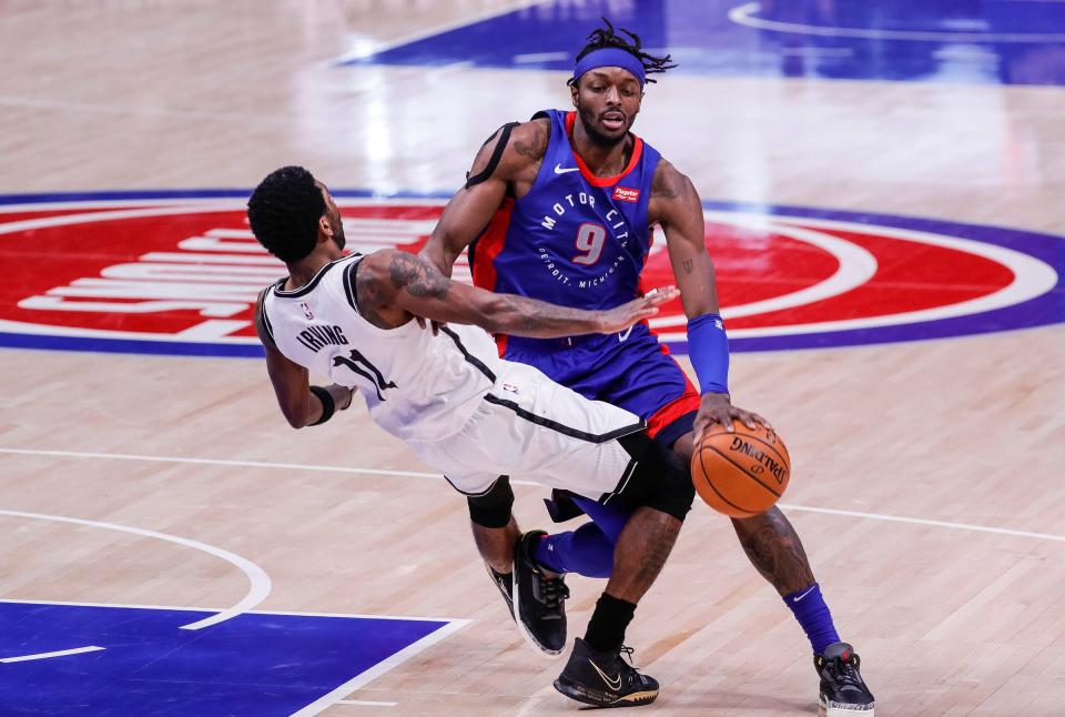 Jerami Grant is fouled by Nets guard Kyrie Irving on Feb. 9. The Pistons face the Nets twice in the second half.