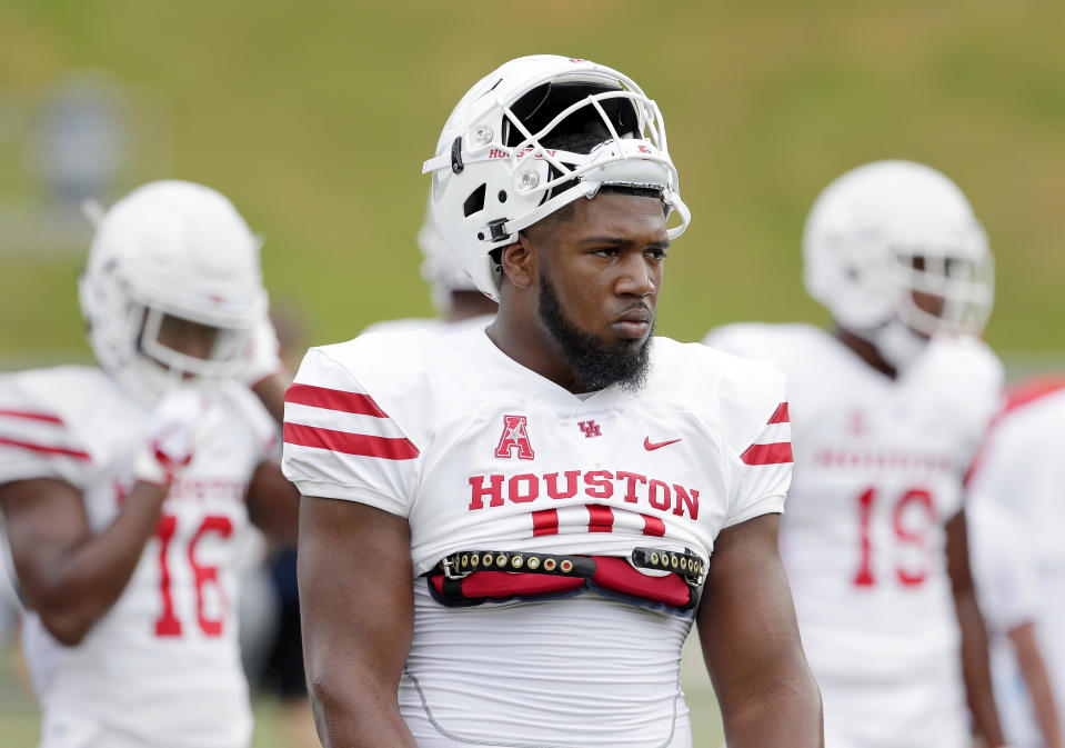 Ed Oliver is not the kind of person you want to rip a jacket off. (AP Photo)