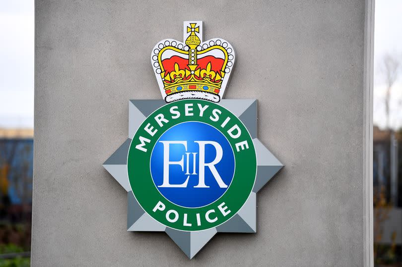 An image of the Merseyside Police badge at the force's HQ