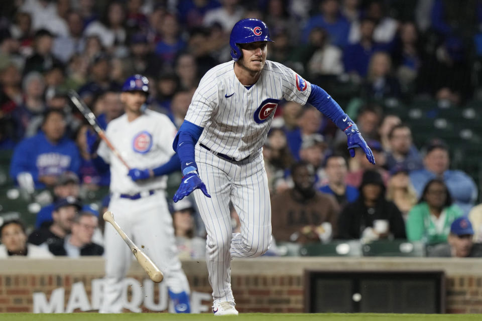 Chicago Cubs' Cody Bellinger watches as he runs after hitting a one-run double during the fourth inning of a baseball game against the Seattle Mariners in Chicago, Monday, April 10, 2023. (AP Photo/Nam Y. Huh)