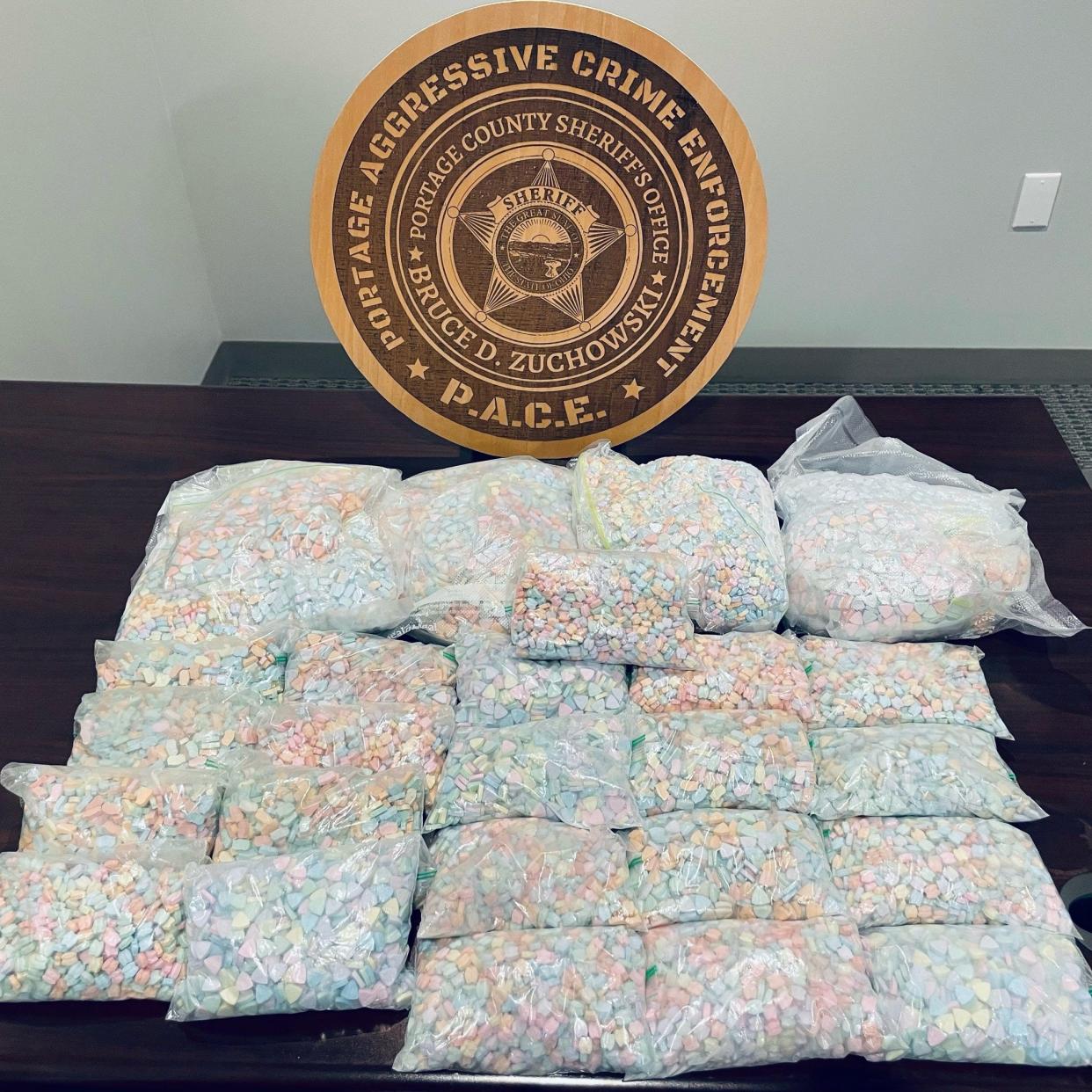 The Portage County Sheriff's Office seized about 24 pounds of suspected Ecstasy pills totaling nearly $1.35 million in value during a traffic stop on the Ohio Turnpike in Freedom Township on Wednesday.