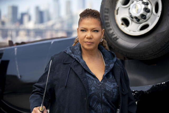 Queen Latifah, 53, shows off her curves in a black swimsuit on