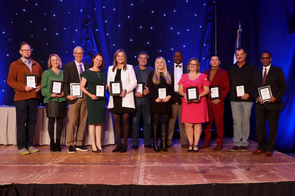 The 2023 Amarillo Globe-News honorees for Headliners, Citizens on the Move Awards and Man and Woman of the Year stand with their awards at a ceremony held at the Amarillo Civic Center on Thursday night.