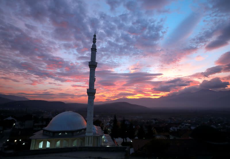 A mosque is seen at sunset in the village of Celopek