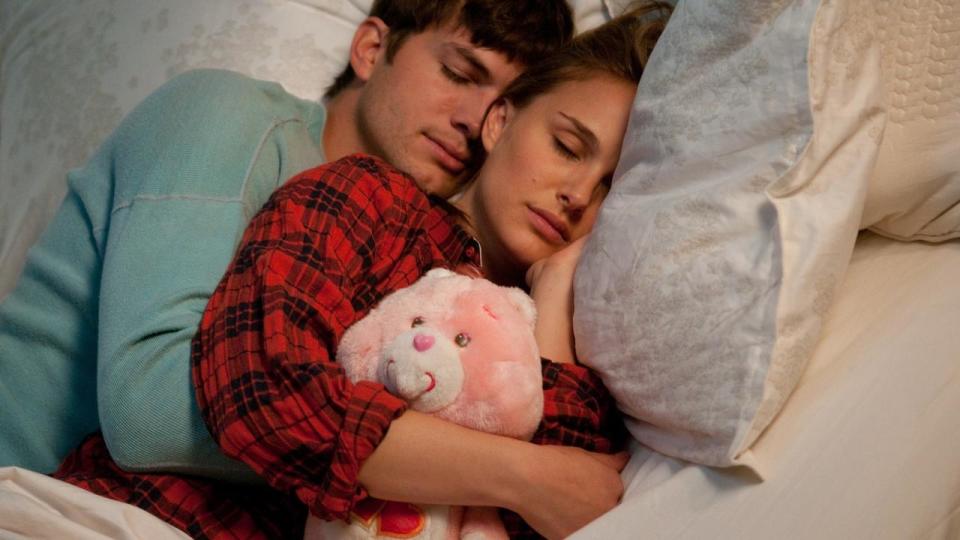 Ashton Kutcher and Natalie Portman spooning in No Strings Attached