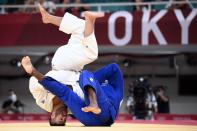 <p>France's Teddy Riner (blue) and Israel's Or Sasson compete in the judo men's +100kg round of sixteen bout during the Tokyo 2020 Olympic Games at the Nippon Budokan in Tokyo on July 30, 2021. (Photo by Franck FIFE / AFP)</p> 