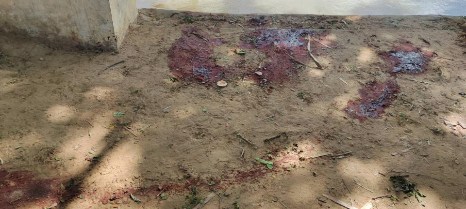 Dried blood stains cover on the floor of a middle school in Let Yet Kone village in Tabayin township in the Sagaing region of Myanmar on Saturday, Sept. 17, 2022, the day after an air strike hit the school. The attack killed a number of adults and children, according to a school administrator and volunteers assisting displaced people. (AP Photo)