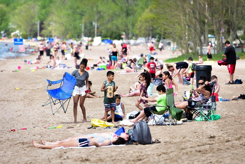 Guests visit the beach during Memorial Day weekend on Saturday, May 23, 2020 at Sylvan Beach.