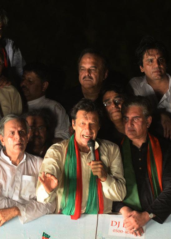 Pakistan cricketer-turned-politician Imran Khan addresses supporters in Lahore on August 14, 2014 as he heads a protest march from Lahore to Islamabad against the government