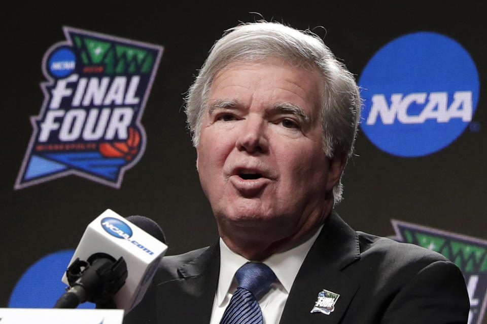FILE - In this April 4, 2019, file photo, NCAA President Mark Emmert answers questions at a news conference at the Final Four college basketball tournament in Minneapolis. Emmert told the organization's more than 1,200 member schools Friday, June 18, 2021, that he will seek temporary rules as early as July to ensure all athletes can be compensated for their celebrity with a host of state laws looming and congressional efforts seemingly stalled. (AP Photo/Matt York, File)