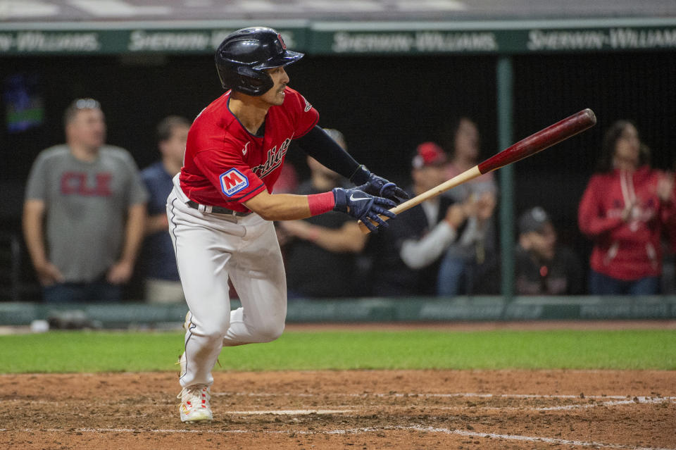 Cleveland Guardians' Steven Kwan watches his RBI single off Texas Rangers relief pitcher Jose Leclerc during the eighth inning of a baseball game in Cleveland, Saturday, Sept. 16, 2023. (AP Photo/Phil Long)