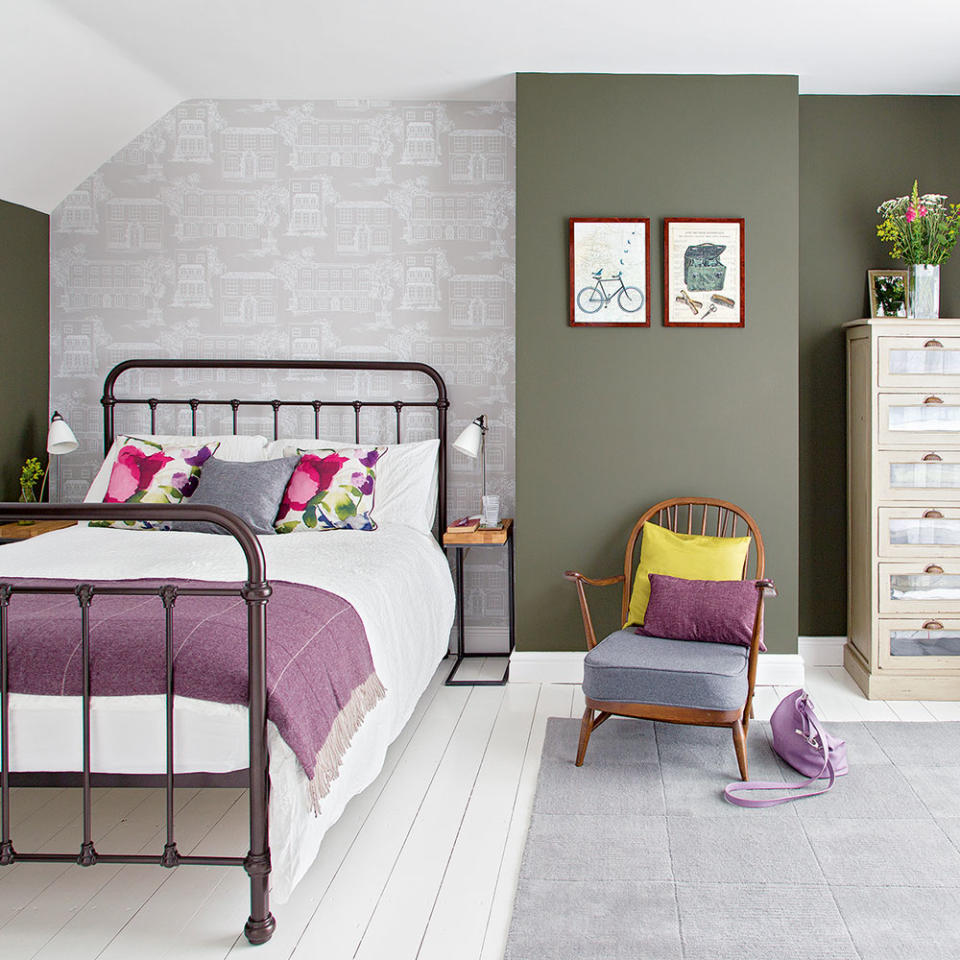 <p> Paint is also a great way to create zones or section off an area of a room. Here, olive green demarcates a dressing and study area, whereas the area behind the bed has been decorated with a paler wallpaper. This attic room is flooded with light from floor-to-celiling windows, so it can take such a dark colour. </p>