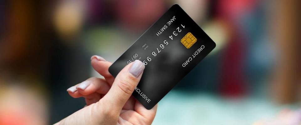 close up of woman hand holding credit card