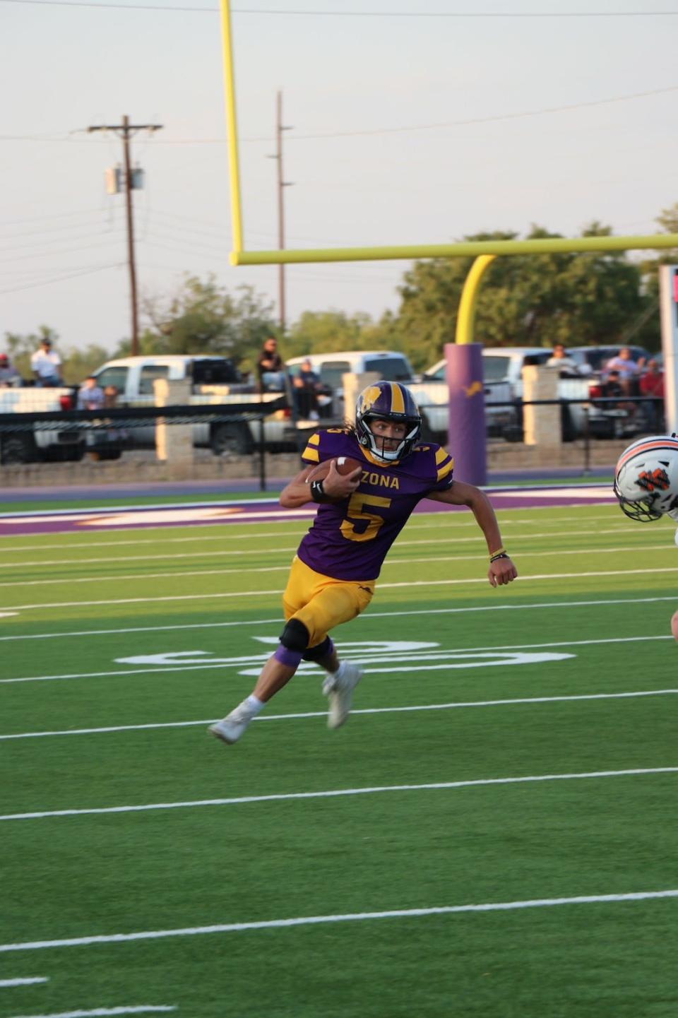 Ozona wide receiver Dusty Smith runs with the football in a matchup against Wink at Lions Stadium on Sept. 1, 2023