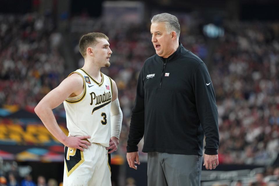 Purdue coach Matt Painter talks to guard Braden Smith (3) during the team's game against North Carolina State at the Final Four of the 2024 NCAA men's tournament at State Farm Stadium.