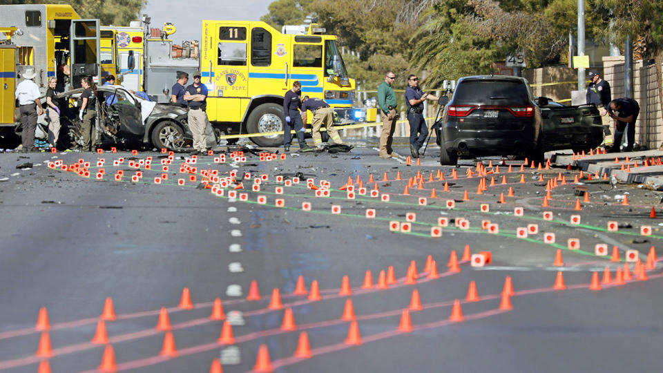 Members of the Clark County Fire Department and the Las Vegas Metropolitan Police Department, pictured here working at the scene of the fatal accident.