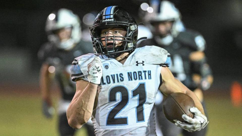 Clovis North’s Jackson Cinfel charges down the sideline on a long run against Central Valley Christian during their game at CVC on Friday, Sept. 8, 2023.