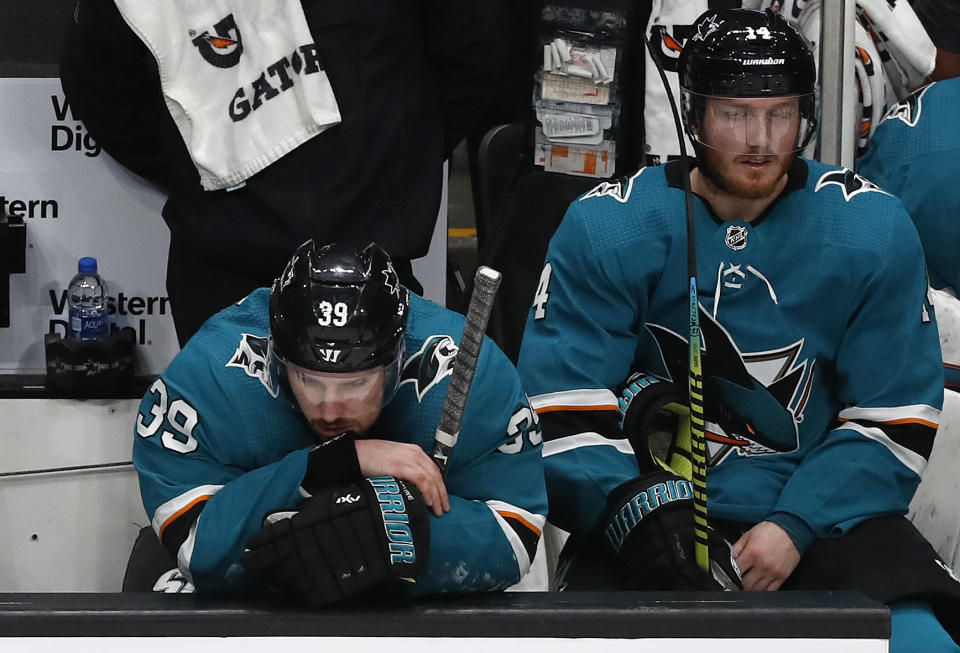 San Jose Sharks' Logan Couture (39) and Gustav Nyquist (14) react on the bench as the St. Louis Blues take a 5-0 lead in the third period in Game 5 of the NHL hockey Stanley Cup Western Conference finals in San Jose, Calif., on Sunday, May 19, 2019. (AP Photo/Josie Lepe)