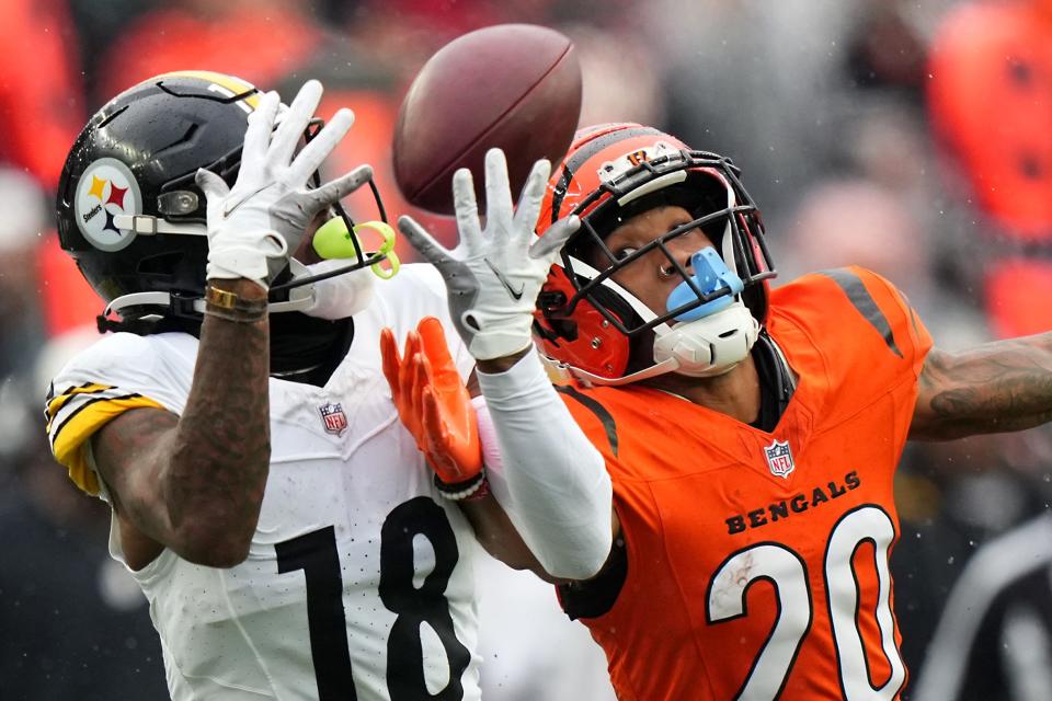 Cincinnati Bengals cornerback DJ Turner II (20) is unable to defend a pass caught by Pittsburgh Steelers wide receiver Diontae Johnson (18) in the second quarter of a Week 12 NFL football game between the Pittsburgh Steelers and the Cincinnati Bengals, Sunday, Nov. 26, 2023, at Paycor Stadium.